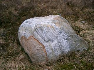 A boulder by L. Ossian.